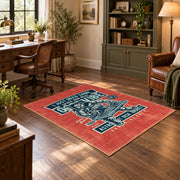 Skull mechanic workshop area rug in red, teal, cream, and black, wood floor styling
