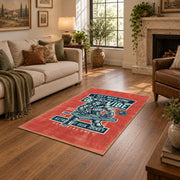 Skull mechanic workshop area rug in red, teal, cream, and black, design detail view