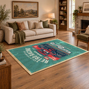 Classic muscle car area rug in teal, red, black, and cream, angled room view