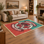 Soccer player emblem area rug in red, teal, cream, and black, angled room view
