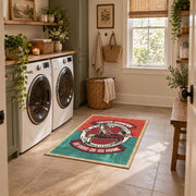 Soccer player emblem area rug in red, teal, cream, and black, design detail view