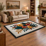 Autumn wildflower bouquet area rug in orange, yellow, teal, and cream, angled room view