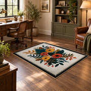 Autumn wildflower bouquet area rug in orange, yellow, teal, and cream, soft surface detail