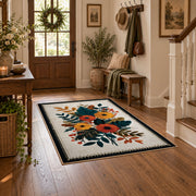 Autumn wildflower bouquet area rug in orange, yellow, teal, and cream, wood floor styling