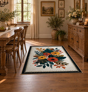 Autumn wildflower bouquet area rug in orange, yellow, teal, and cream, close decorative detail