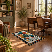 Mid century botanical area rug in teal, orange, mustard, and cream, complete product view