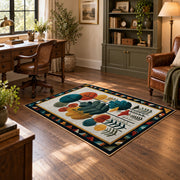 Mid century botanical area rug in teal, orange, mustard, and cream, soft surface detail