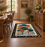 Mid century botanical area rug in teal, orange, mustard, and cream, close decorative detail