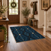 Navy geometric diamond area rug in deep blue, black, and beige, wood floor styling