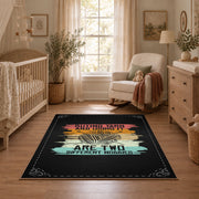 Knitting yarn quote area rug in black with coral, teal, yellow, and cream accents, full pattern view