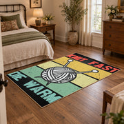 Retro knitting yarn area rug in yellow, mint, coral, black, and cream, soft surface detail