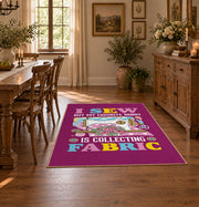 Colorful sewing machine area rug in magenta, yellow, teal, and pink, close decorative detail