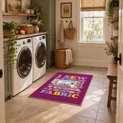 Colorful sewing machine area rug in magenta, yellow, teal, and pink, wide interior view