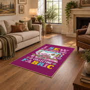 Colorful sewing machine area rug in magenta, yellow, teal, and pink, design detail view
