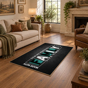 Funny family typography area rug in black, white, and teal, cozy home setting