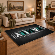 Funny family typography area rug in black, white, and teal, angled room view