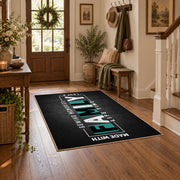 Funny family typography area rug in black, white, and teal, close decorative detail