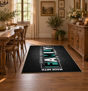 Funny family typography area rug in black, white, and teal, front room mockup