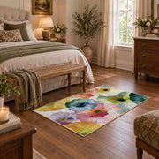 Pastel watercolor floral area rug in pink, yellow, green, blue, and lavender, cozy home setting