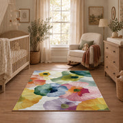 Pastel watercolor floral area rug in pink, yellow, green, blue, and lavender, full pattern view