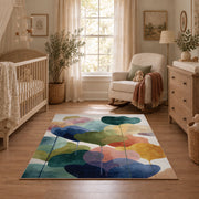 Pastel abstract pebble area rug in teal, navy, coral, yellow, and blush, full pattern view