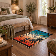 California beach typography area rug in teal, orange, cream, and black, featured room view