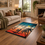 California beach typography area rug in teal, orange, cream, and black, cozy home setting