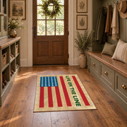 American flag tribute area rug in beige, red, blue, and cream, wide interior view