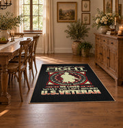 Military service emblem area rug in black, red, cream, and gold, close decorative detail