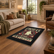 Military service emblem area rug in black, red, cream, and gold, design detail view