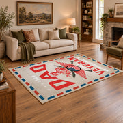 Veteran freedom tribute area rug in cream, red, blue, and black, angled room view