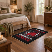 Space service emblem area rug in black, red, white, and gray, cozy home setting
