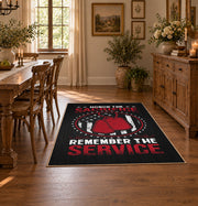 Space service emblem area rug in black, red, white, and gray, close decorative detail