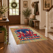 Military service shield area rug in beige, blue, red, and cream, wood floor styling