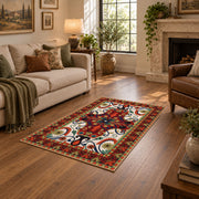Red and blue ornate floral area rug with a traditional medallion pattern, design detail view