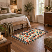 Cream and orange folk floral area rug with a symmetrical traditional pattern, cozy home setting