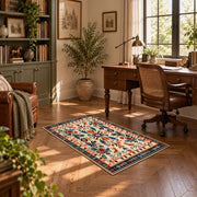 Cream and orange folk floral area rug with a symmetrical traditional pattern, complete product view