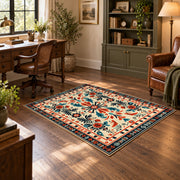 Cream and orange folk floral area rug with a symmetrical traditional pattern, soft surface detail