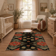 Black patchwork medallion area rug in red, beige, gold, and charcoal, angled room view