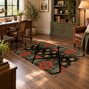 Black patchwork medallion area rug in red, beige, gold, and charcoal, soft surface detail