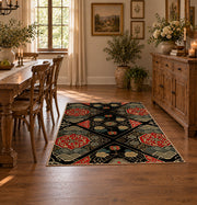 Black patchwork medallion area rug in red, beige, gold, and charcoal, close decorative detail