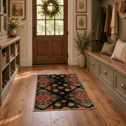 Black patchwork medallion area rug in red, beige, gold, and charcoal, front room mockup