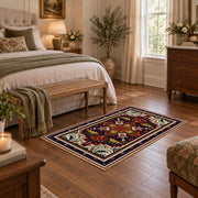 Red and navy Persian medallion area rug with ornate floral details, cozy home setting