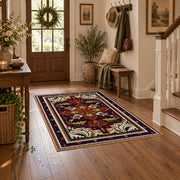 Red and navy Persian medallion area rug with ornate floral details, wood floor styling