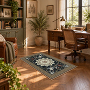Black and cream floral medallion area rug with a traditional Persian layout, featured room view