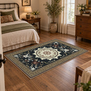 Black and cream floral medallion area rug with a traditional Persian layout, soft surface detail