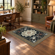 Black and cream floral medallion area rug with a traditional Persian layout, wood floor styling
