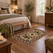 Beige and red tribal symbol area rug with a geometric Southwest-inspired pattern, cozy home setting