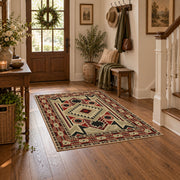 Beige and red tribal symbol area rug with a geometric Southwest-inspired pattern, close decorative detail