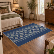 Blue and white geometric area rug with a minimal diamond pattern, soft surface detail